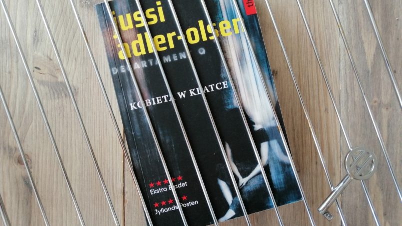 Okładka książki "Kobieta w klatce" Jussi Adler-Olsen